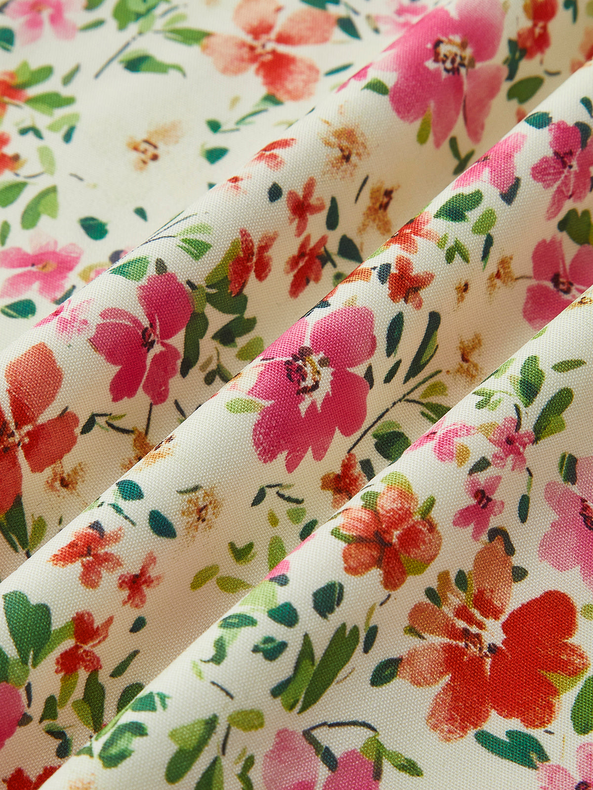 Robe mi-longue à imprimé floral à fines bretelles