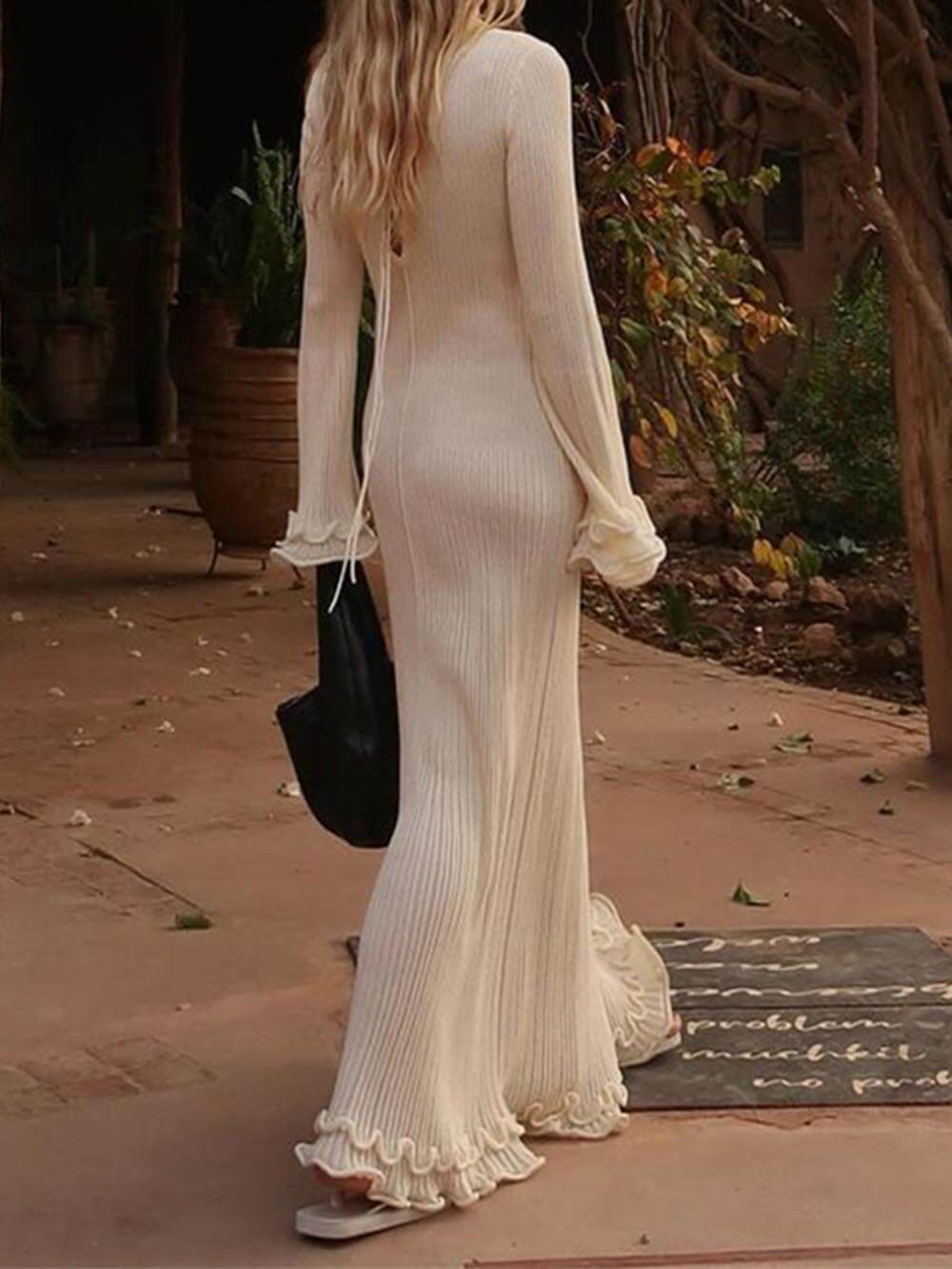 Robe longue élégante en maille manches trompette